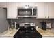 Modern kitchen with stainless steel appliances and granite countertops at 6101 W Grandview Rd, Glendale, AZ 85306