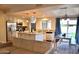 Well-lit kitchen with an island, stainless steel appliances, and a view to the outside at 6101 W Grandview Rd, Glendale, AZ 85306