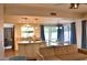Open-concept living space showcasing an island kitchen, dining area, and living room for seamless living at 6101 W Grandview Rd, Glendale, AZ 85306