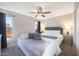 Bedroom with large bed, day bed, ceiling fan, and natural light at 6101 W Grandview Rd, Glendale, AZ 85306