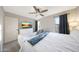 Bright bedroom featuring a bed, tv, and windows at 6101 W Grandview Rd, Glendale, AZ 85306