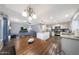 Spacious open floor plan with a kitchen, dining area, and living room for seamless living at 6101 W Grandview Rd, Glendale, AZ 85306