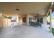 Expansive covered patio featuring a ceiling fan, furniture, and a view of the backyard at 6101 W Grandview Rd, Glendale, AZ 85306