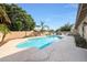 Lush backyard with blue swimming pool, plenty of space for chairs, and tall privacy fence at 6101 W Grandview Rd, Glendale, AZ 85306