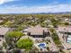 Community aerial view of a single-Gathering home with a pool, patio, desert landscaping, and lawn in the backyard at 6765 E Duane Ln, Scottsdale, AZ 85266