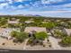 Aerial view of the home and neighborhood, displaying mountain views and desert landscaping at 6765 E Duane Ln, Scottsdale, AZ 85266