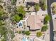 Aerial view of the home and neighborhood showcasing the backyard pool and desert landscaping at 6765 E Duane Ln, Scottsdale, AZ 85266