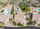 Aerial view of neighborhood with desert landscaping and home featuring a backyard pool at 6765 E Duane Ln, Scottsdale, AZ 85266