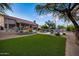 Backyard featuring a pristine pool, desert landscaping, and lounge seating at 6765 E Duane Ln, Scottsdale, AZ 85266