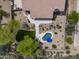 Backyard aerial view showcasing the pool, small lawn, patio, desert landscaping and fenced-in yard at 6765 E Duane Ln, Scottsdale, AZ 85266