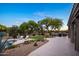 Expansive backyard featuring a pristine pool, lounge chairs, barbecue grill and desert landscaping at 6765 E Duane Ln, Scottsdale, AZ 85266