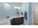 Bathroom features light blue walls, dark wood vanity, and white marble countertop at 6765 E Duane Ln, Scottsdale, AZ 85266