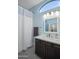 Well-lit bathroom features a dark vanity with a white countertop and a shower curtain at 6765 E Duane Ln, Scottsdale, AZ 85266