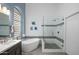 Bright bathroom with a freestanding tub and a separate glass-enclosed shower with stylish tile accents at 6765 E Duane Ln, Scottsdale, AZ 85266