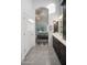 En-suite bathroom featuring double sinks and a doorway leading into the Primary bedroom at 6765 E Duane Ln, Scottsdale, AZ 85266