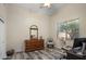 Bedroom with a wooden dresser, chair, and desk near a window with natural light at 6765 E Duane Ln, Scottsdale, AZ 85266