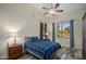 Bedroom features a cozy bed with nightstands, dark wood floors, and neutral-colored walls at 6765 E Duane Ln, Scottsdale, AZ 85266