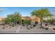 Stunning home exterior featuring desert landscaping, mature trees, and a welcoming entrance at 6765 E Duane Ln, Scottsdale, AZ 85266
