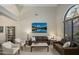 Comfortable living room featuring two sofas, natural light, vaulted ceilings, and neutral tones at 6765 E Duane Ln, Scottsdale, AZ 85266