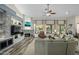 Spacious living room with a stone fireplace, large windows, and comfortable seating area at 6765 E Duane Ln, Scottsdale, AZ 85266