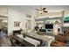 Open-concept living area with dining space, comfortable seating, and built-in entertainment center at 6765 E Duane Ln, Scottsdale, AZ 85266