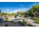Inviting pool area surrounded by desert landscaping and ample seating, creating a serene outdoor oasis at 6765 E Duane Ln, Scottsdale, AZ 85266
