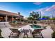 Desert landscaped backyard showcasing a pristine pool, desert landscaping, and lounge seating at 6765 E Duane Ln, Scottsdale, AZ 85266