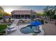 Resort-style backyard showcasing a pool, desert landscaping, and covered patio for ultimate relaxation and entertainment at 6765 E Duane Ln, Scottsdale, AZ 85266