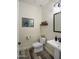 Cozy powder room with modern fixtures, decorative mirror, and stylish accents at 6765 E Duane Ln, Scottsdale, AZ 85266