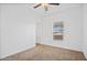 Neutral bedroom featuring carpet, ceiling fan, a window and white walls at 7807 E Main St # F36, Mesa, AZ 85207