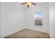 Bedroom featuring neutral carpet, ceiling fan, a window and white walls at 7807 E Main St # F36, Mesa, AZ 85207