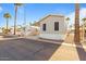 Exterior view of a charming single-story home featuring desert landscaping and covered parking at 7807 E Main St # F36, Mesa, AZ 85207