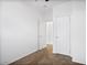 Hallway with carpeted floors, white walls and two white doors at 7807 E Main St # F36, Mesa, AZ 85207