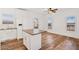 Bright living area features an island, modern appliances and wood-look floors at 7807 E Main St # F36, Mesa, AZ 85207