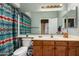 Bathroom with patterned shower curtain and cabinets at 9938 E Little Nugget Way, Gold Canyon, AZ 85118