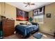 Cozy bedroom with yellow walls, carpet, and a ceiling fan at 9938 E Little Nugget Way, Gold Canyon, AZ 85118
