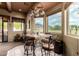 Dining area features mountain views, modern light fixture and access to outdoor living at 9938 E Little Nugget Way, Gold Canyon, AZ 85118