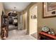 Hallway view featuring tiled floors, arched doorways, and decorative accents at 9938 E Little Nugget Way, Gold Canyon, AZ 85118
