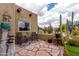 Inviting outdoor patio area with comfortable seating and desert landscaping at 9938 E Little Nugget Way, Gold Canyon, AZ 85118