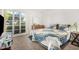 Inviting bedroom with a queen-size bed, soft natural light, and a calming atmosphere at 10040 W Royal Oak Rd # N, Sun City, AZ 85351