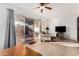 Bright living area featuring tile floors, neutral sofa, and sliding door access to the patio at 10040 W Royal Oak Rd # N, Sun City, AZ 85351