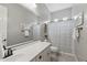 Well-lit bathroom with a large vanity, tub and shower combination, and neutral color scheme at 10154 E Bergeron Ave, Mesa, AZ 85212
