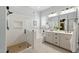 Modern bathroom featuring a glass-enclosed shower, soaking tub, and double vanity at 10154 E Bergeron Ave, Mesa, AZ 85212