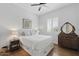 Cozy bedroom featuring hardwood floors, a queen-sized bed, and vintage-style vanity at 10154 E Bergeron Ave, Mesa, AZ 85212