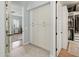 Hallway with built-in storage cabinets leading to main bedroom and a walk-in closet at 10154 E Bergeron Ave, Mesa, AZ 85212