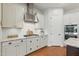 Kitchen featuring white cabinets, subway tile backsplash, stainless steel appliances, and granite countertops at 10154 E Bergeron Ave, Mesa, AZ 85212