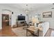 Relaxing living room featuring hardwood floors, neutral furniture, and an inviting atmosphere at 10154 E Bergeron Ave, Mesa, AZ 85212