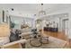 Spacious living space with an open floor plan connecting the living room, dining area, and kitchen at 10154 E Bergeron Ave, Mesa, AZ 85212
