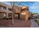 Attractive southwestern-style condo building with multiple levels and well-maintained landscape at 11640 N 51St Ave # 248, Glendale, AZ 85304