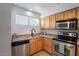 Well-lit kitchen featuring modern appliances and stainless steel accents at 11640 N 51St Ave # 248, Glendale, AZ 85304